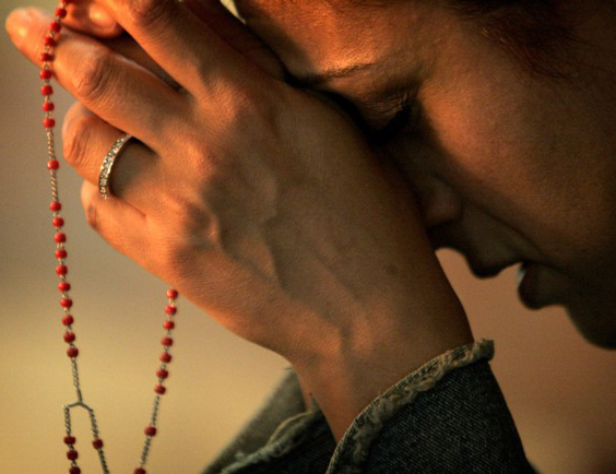 praying-the-rosary-7246211-300x230