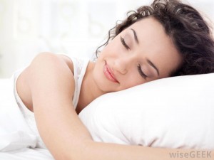woman-sleeping-in-bed-on-pillow
