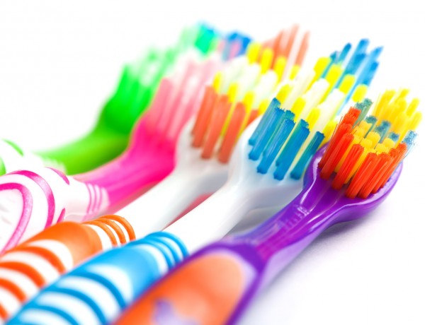 set of multicolored toothbrushes isolated on white