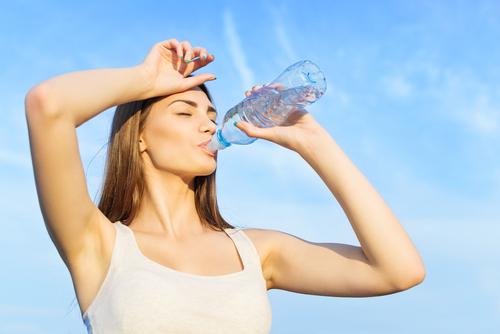 woman-drinking-water-after-workout