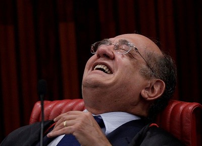 President of the Superior Electoral Court Mendes smiles during a session where Brazil's electoral court will take up a 2014 case that could unseat President Temer in Brasilia