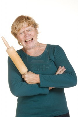 very-furious-woman-with-wooden-roller-pin