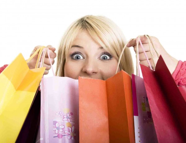 Excited Shopping Woman isolated on white