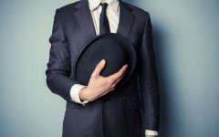 Man holding a bowler hat