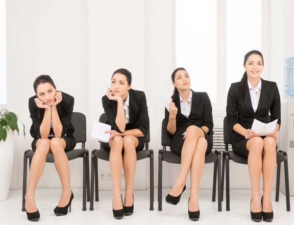 Four different poses of one woman waiting for interview. Sitting in office on chair.