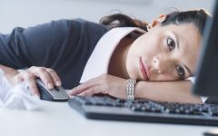 USA, New Jersey, Jersey City, Businesswoman in front of computer, looking tired